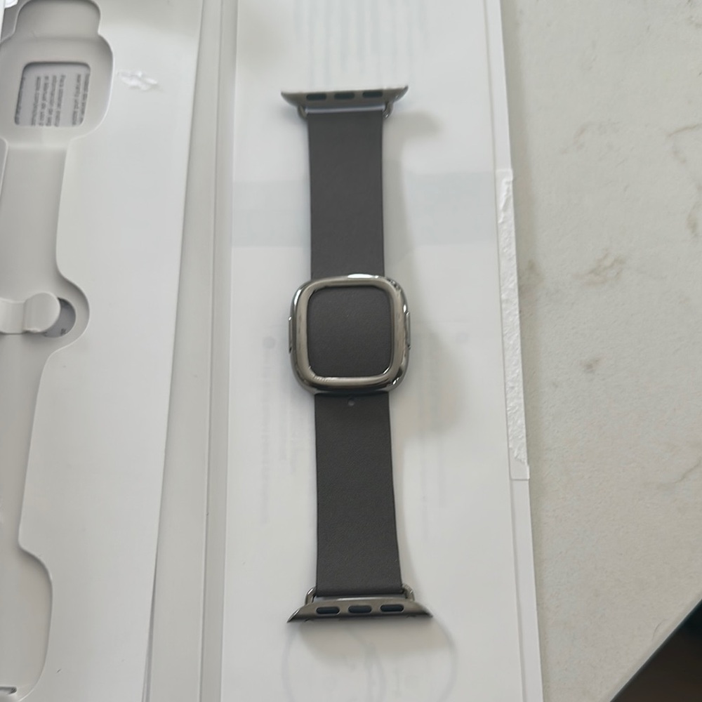Apple Smartwatch with Metallic Silver Frame and Dark Gray Band